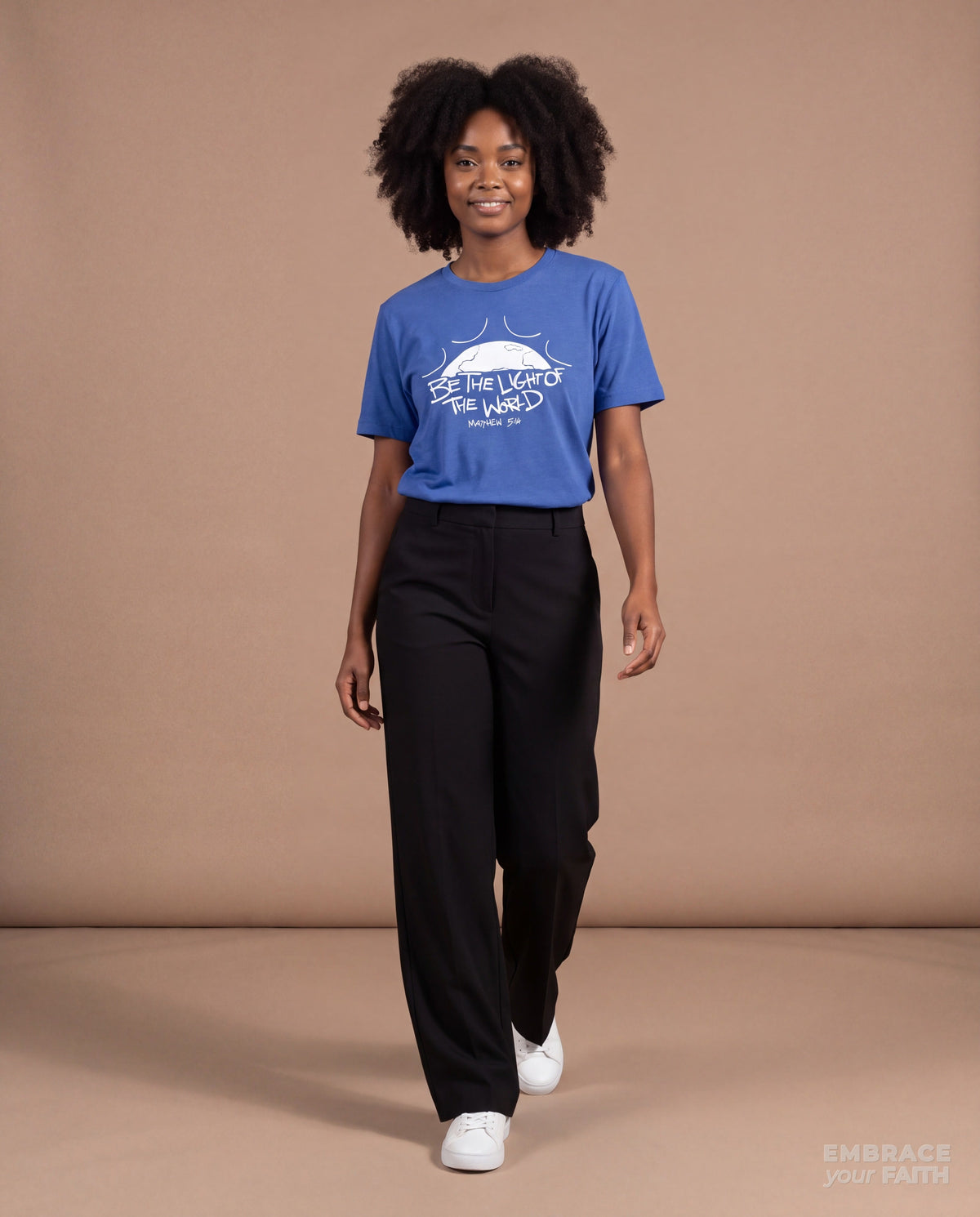 Be the Light of the World T-Shirt with white print in True Royal, worn by a model