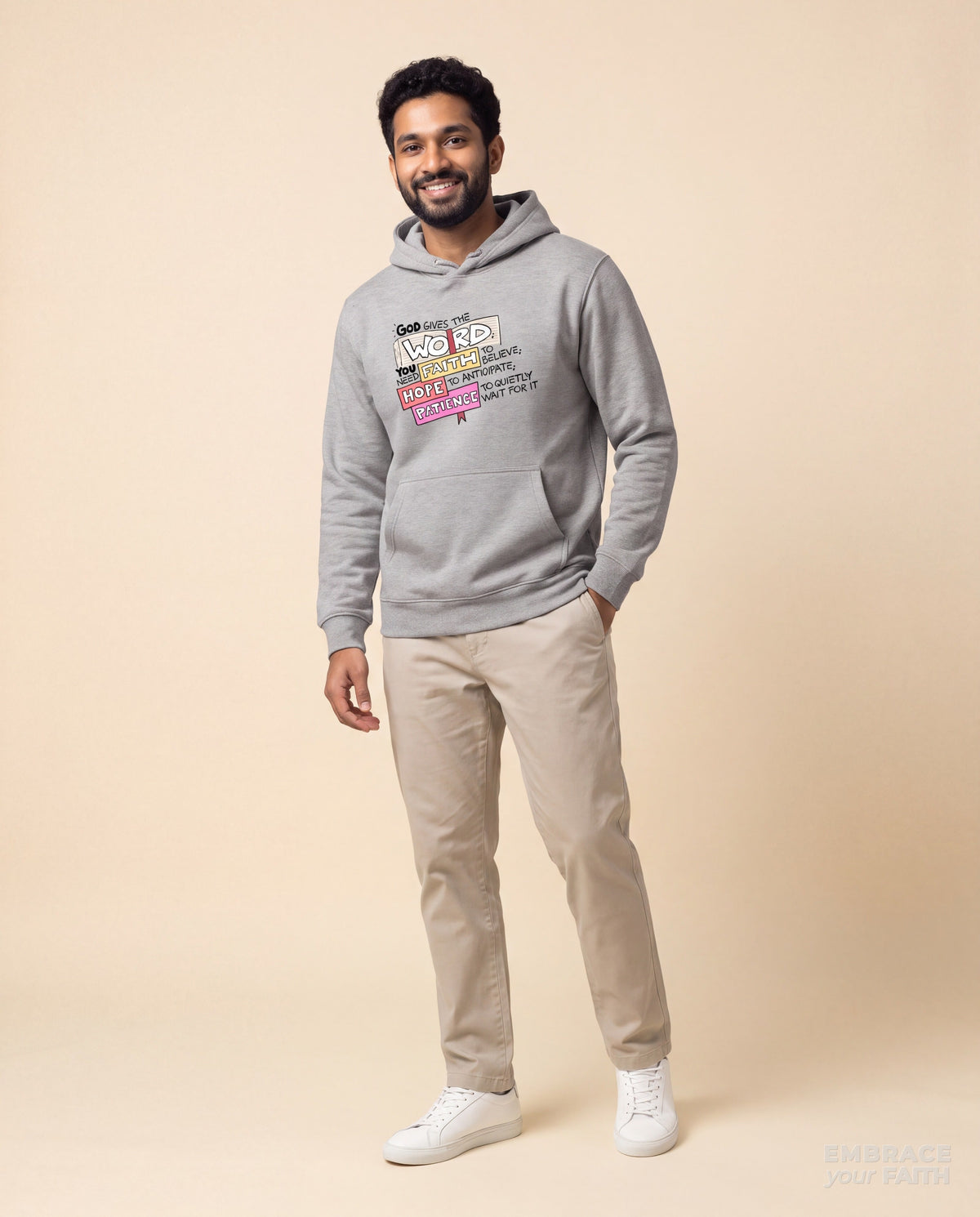 EYF model wearing the God Gives the Word Unisex Hoodie (Premium) in Carbon Grey