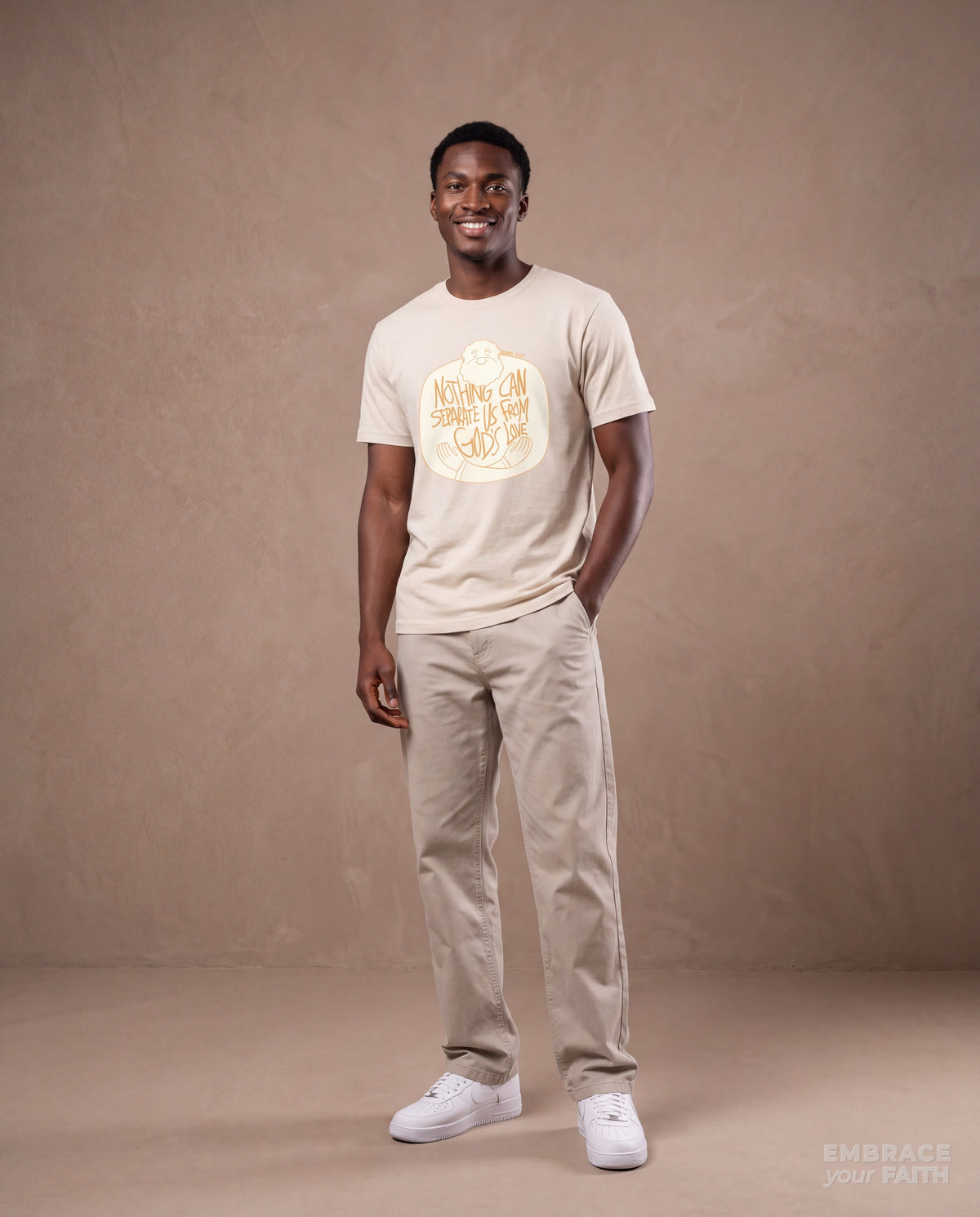 EYF model wearing the Nothing Can Separate Us from God’s Love Unisex T-Shirt in Natural